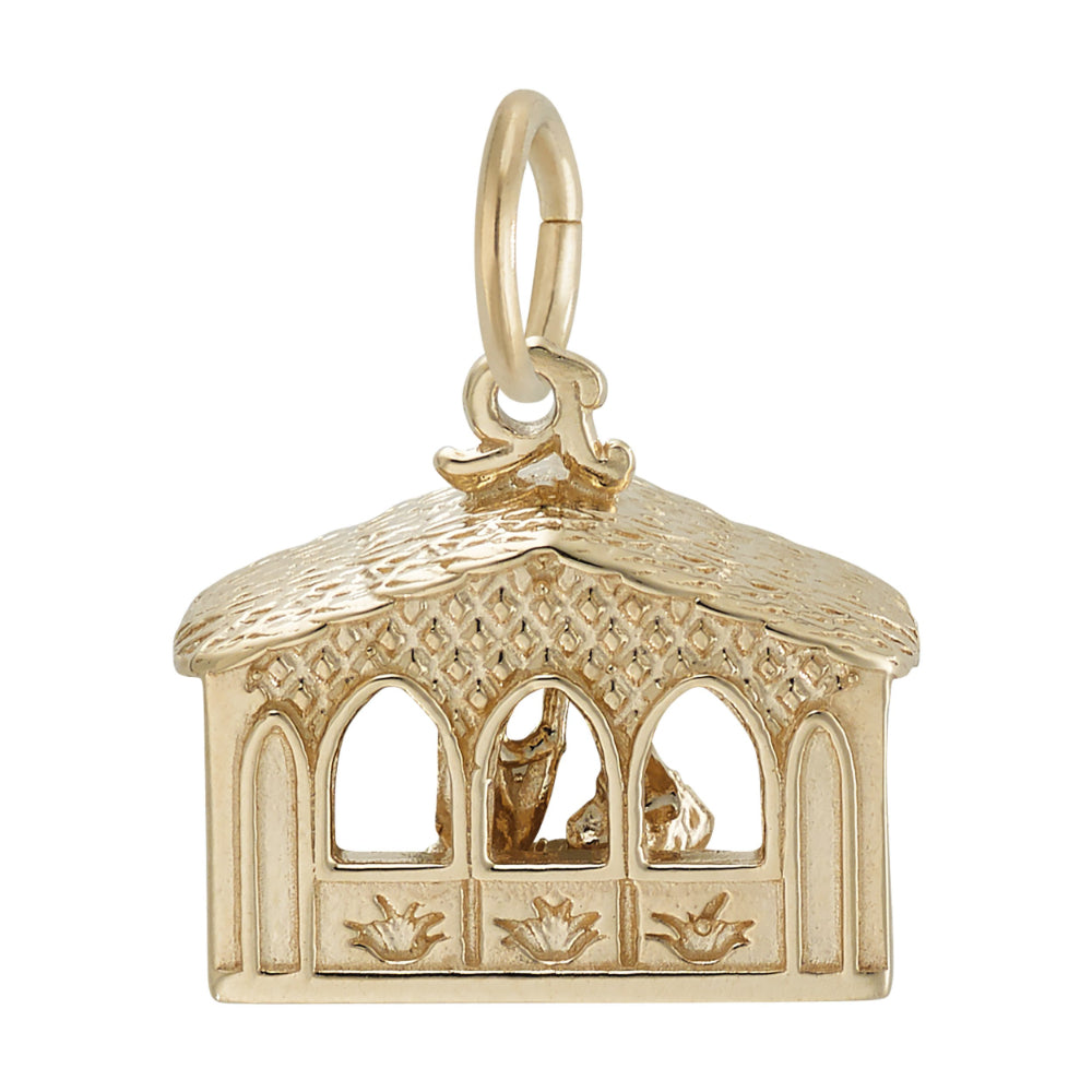 Gold nativity scene charm with detailed roof and wall, shown on a white background