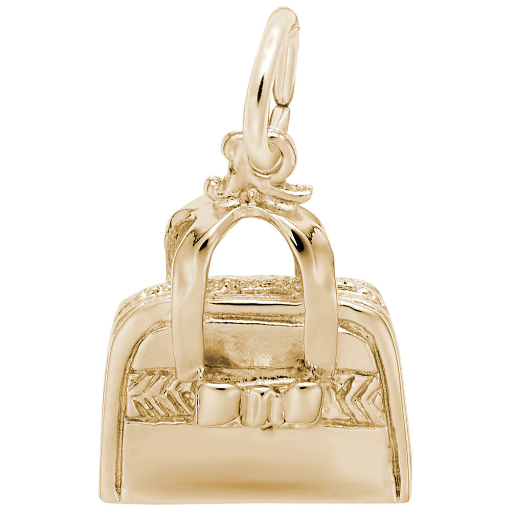 Gold handbag charm with with a bow and detailing, shown on a white background