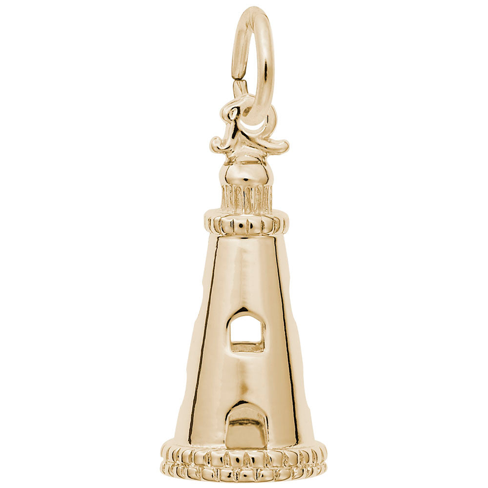 Gold lighthouse charm on a white background