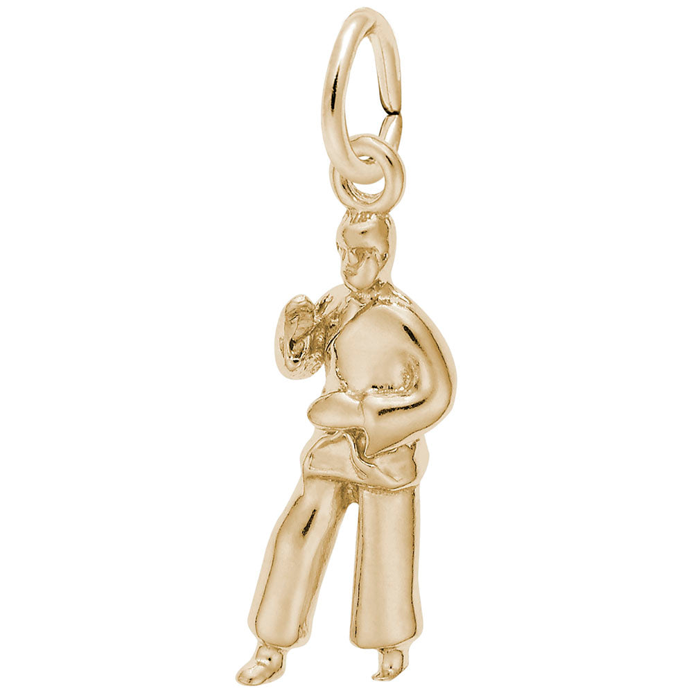 Gold charm depicting a martial arts figure, shown on a white background