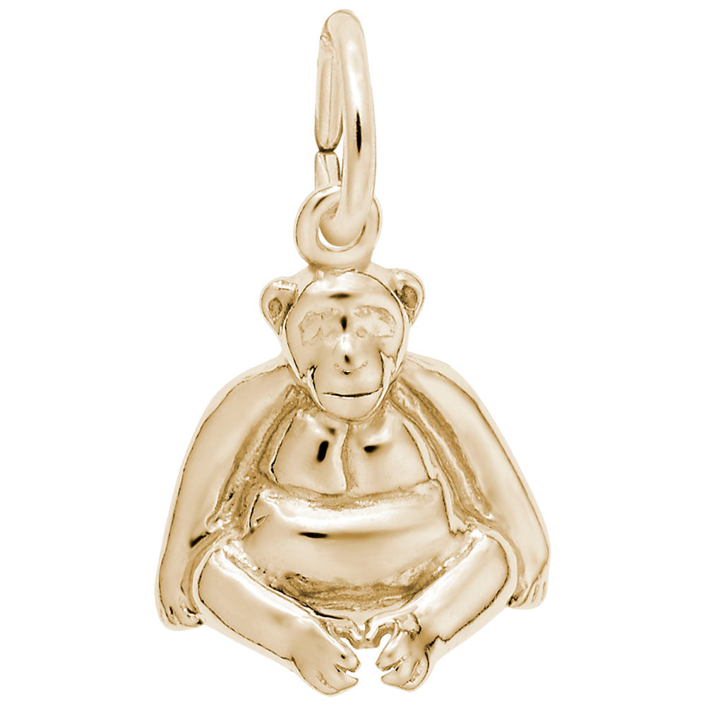 Gold monkey pendant on a white background