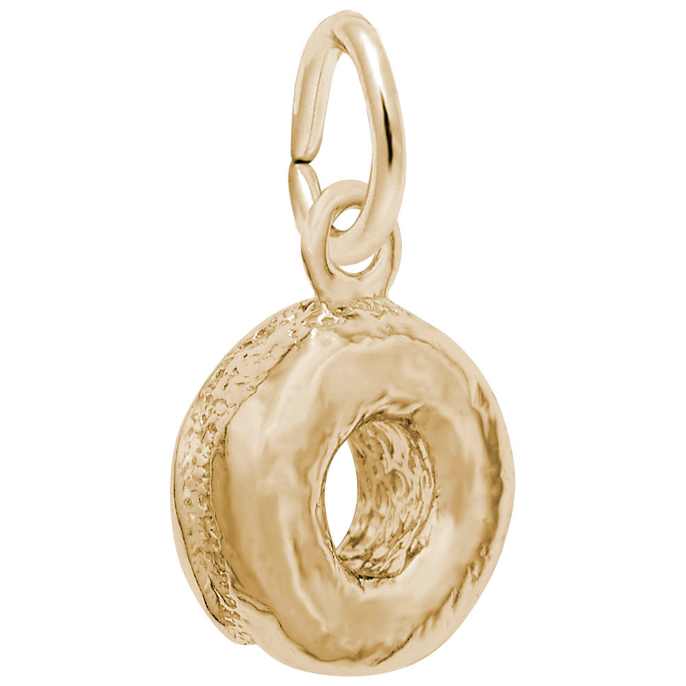 Gold donut-shaped charm on a white background