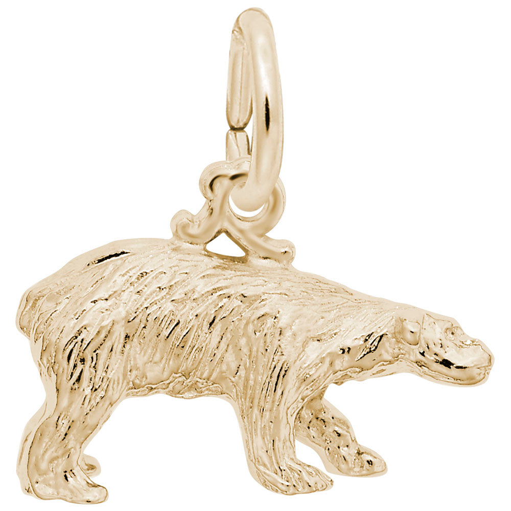 Gold polar bear charm on a white background