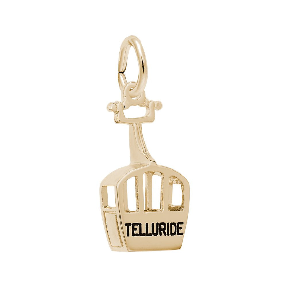 A gold cable car charm with the word 'TELLURIDE' engraved on the front, set against a plain white background.