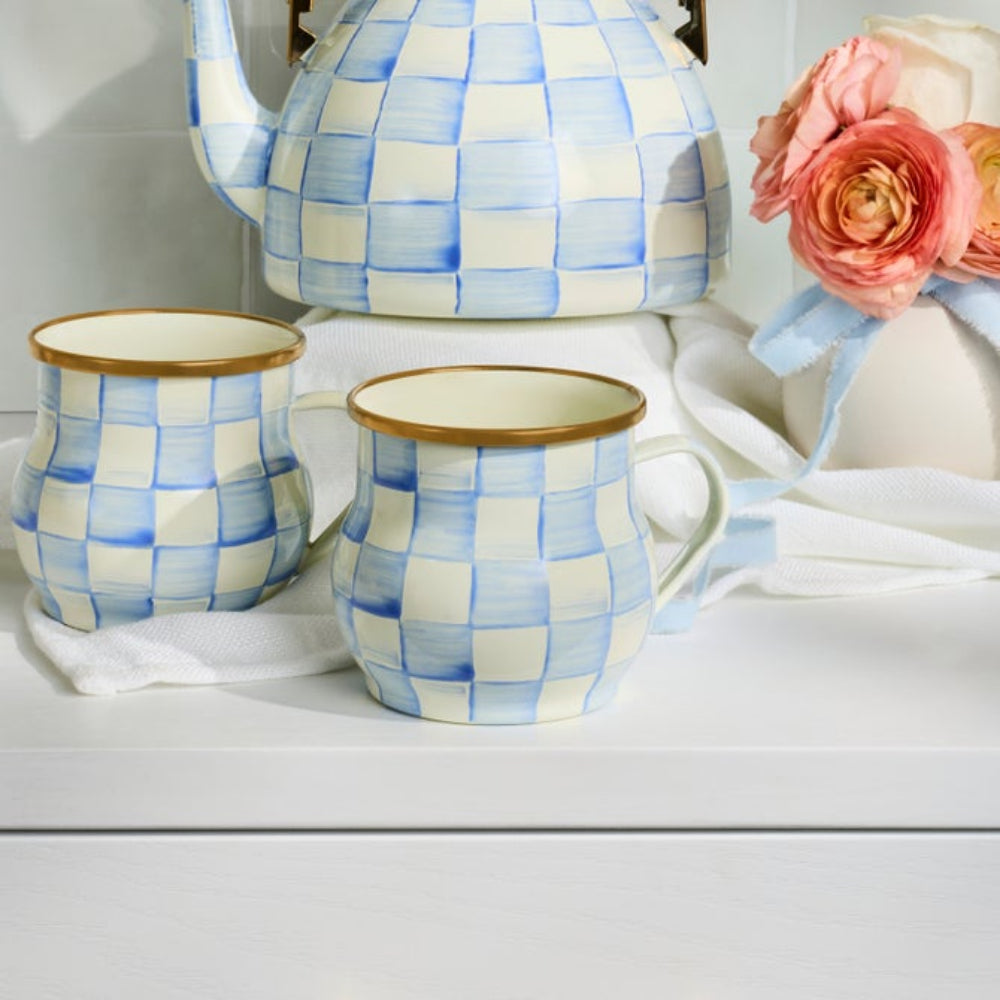 Sky Check Mugs with Sky Check Tea Kettle on display with flower decor piece.