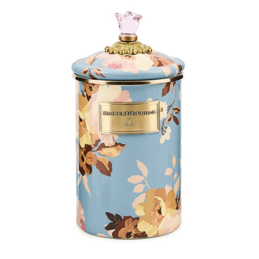 Floral-patterned candle jar with decorative lid on a white background