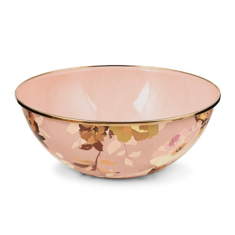 Pink glass bowl with floral pattern and gold rim on a white background