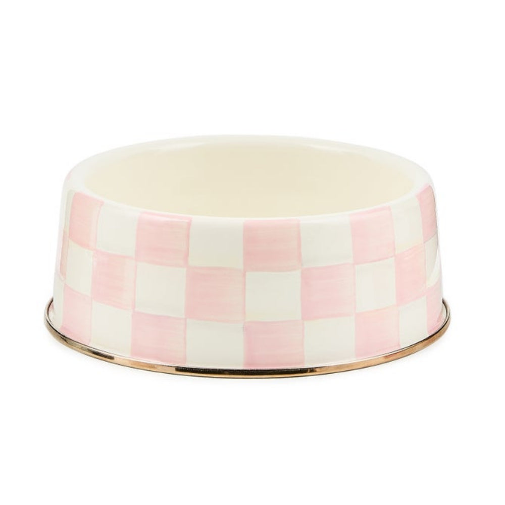 A ceramic pet bowl featuring a pink and white checkerboard pattern with a polished gold metallic rim, shown on a plain white background.