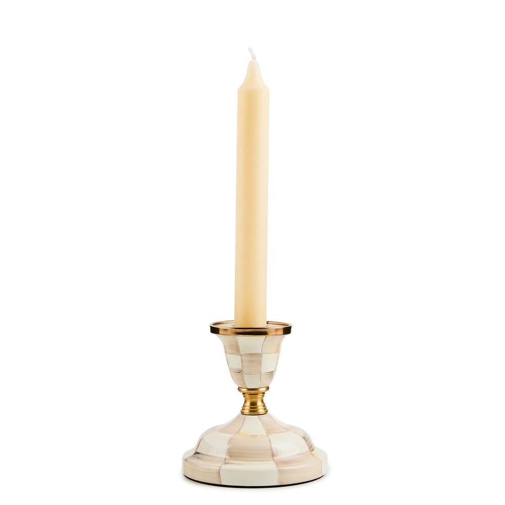Candle holder with a candle on a white background