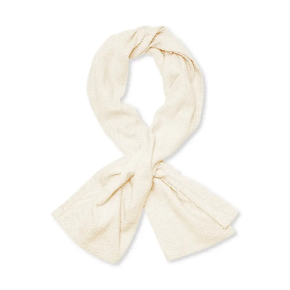 A white/cream shawl on a white background.