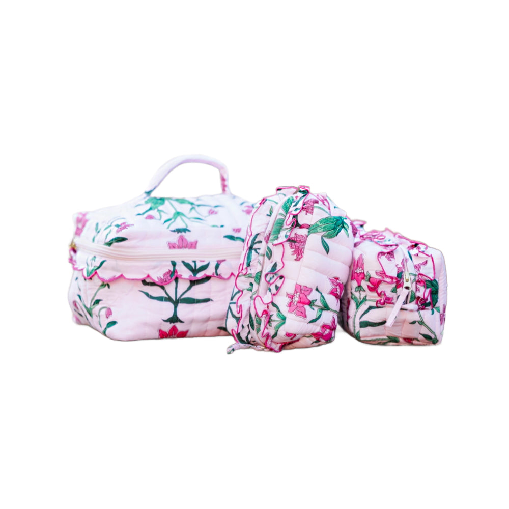 Floral-patterned makeup bag and travel case on a white background