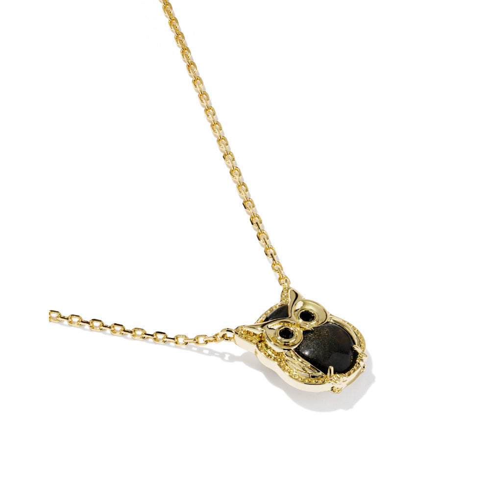 Gold owl pendant necklace with black enamel details, shown on a clean white background.