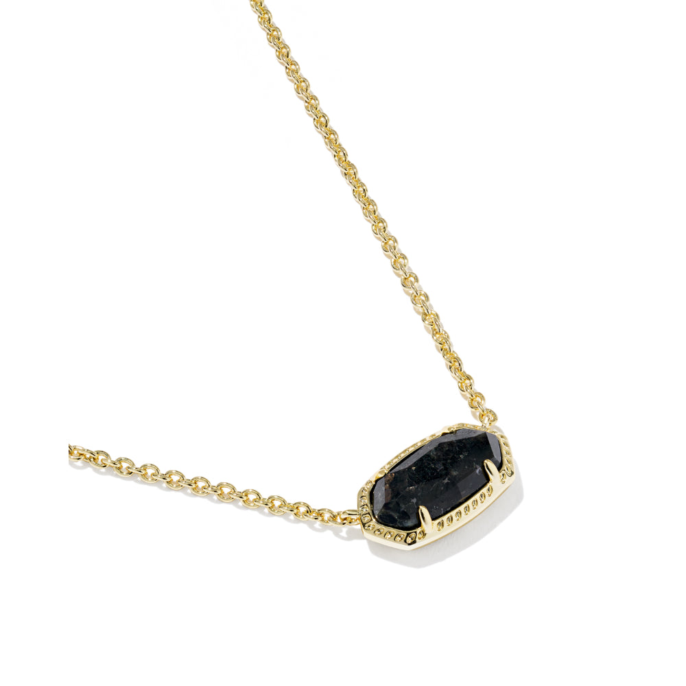 A gold chain necklace featuring a bezel-set black stone pendant with a textured, hammered edge, displayed on a clean white background.