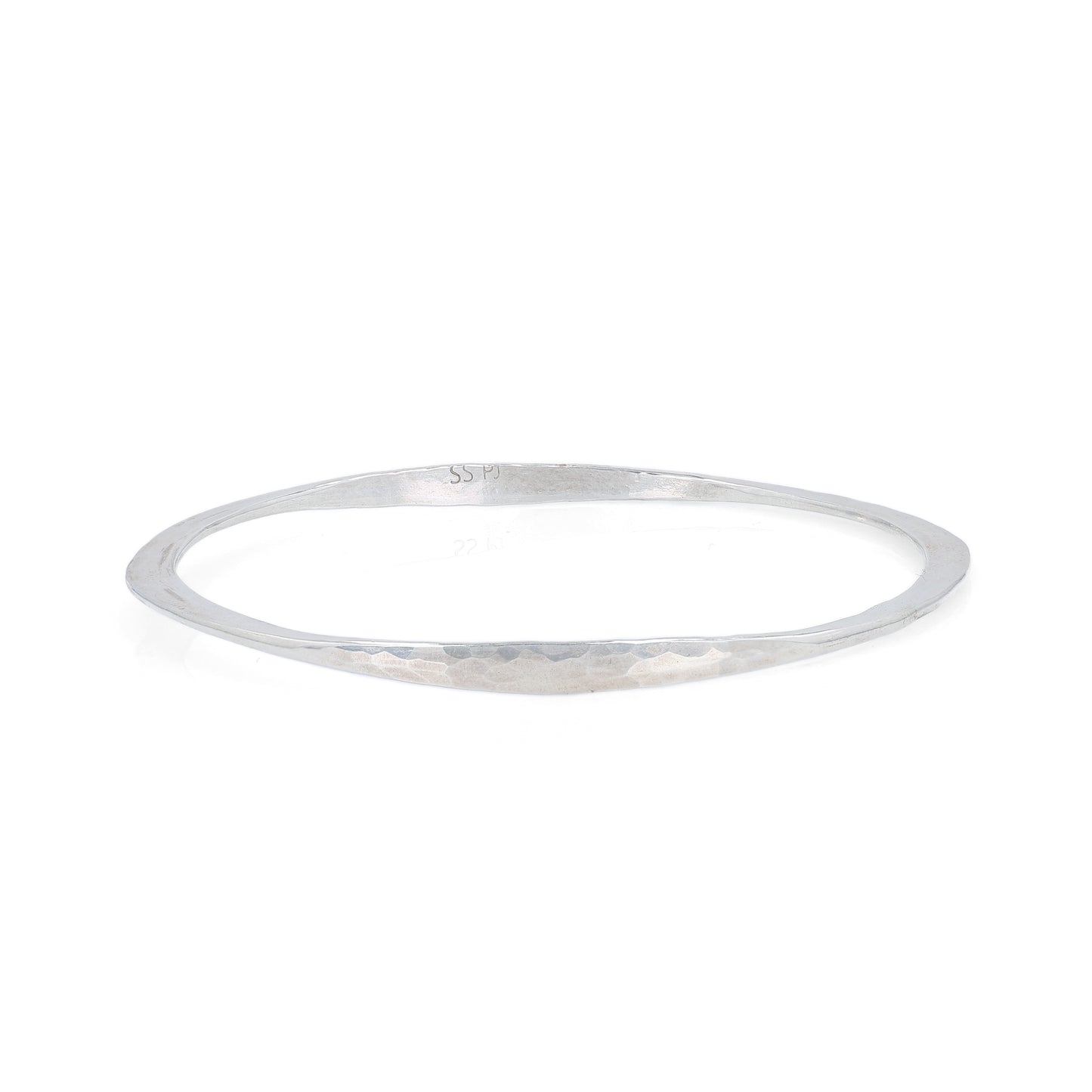Silver hammered bangle bracelet on a white background