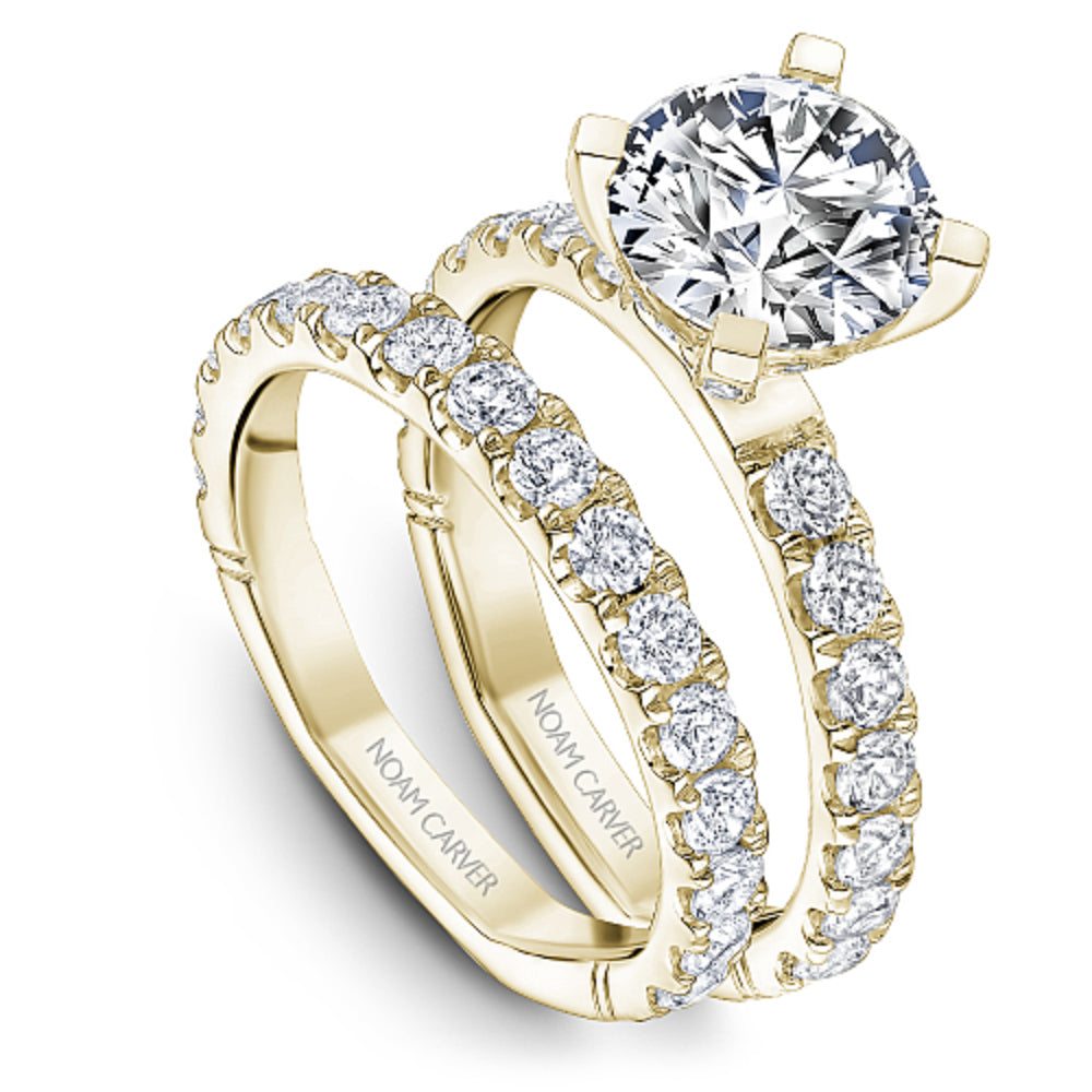 Yellow gold diamond ring with 'Noam Carver' branding on a white background