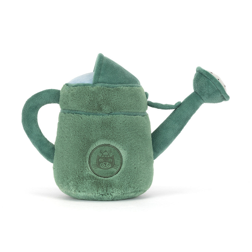 A photo of the back of a green plush toy watering can with a smiling face and brown legs with a Jellycat logo on a white background.