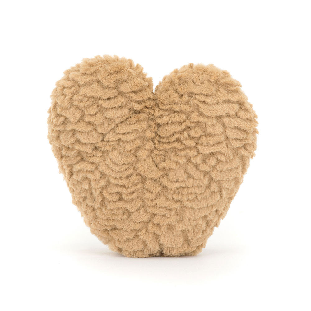 A photo of the back of a brown heart-shaped plush toy with a smiling face on a white background.