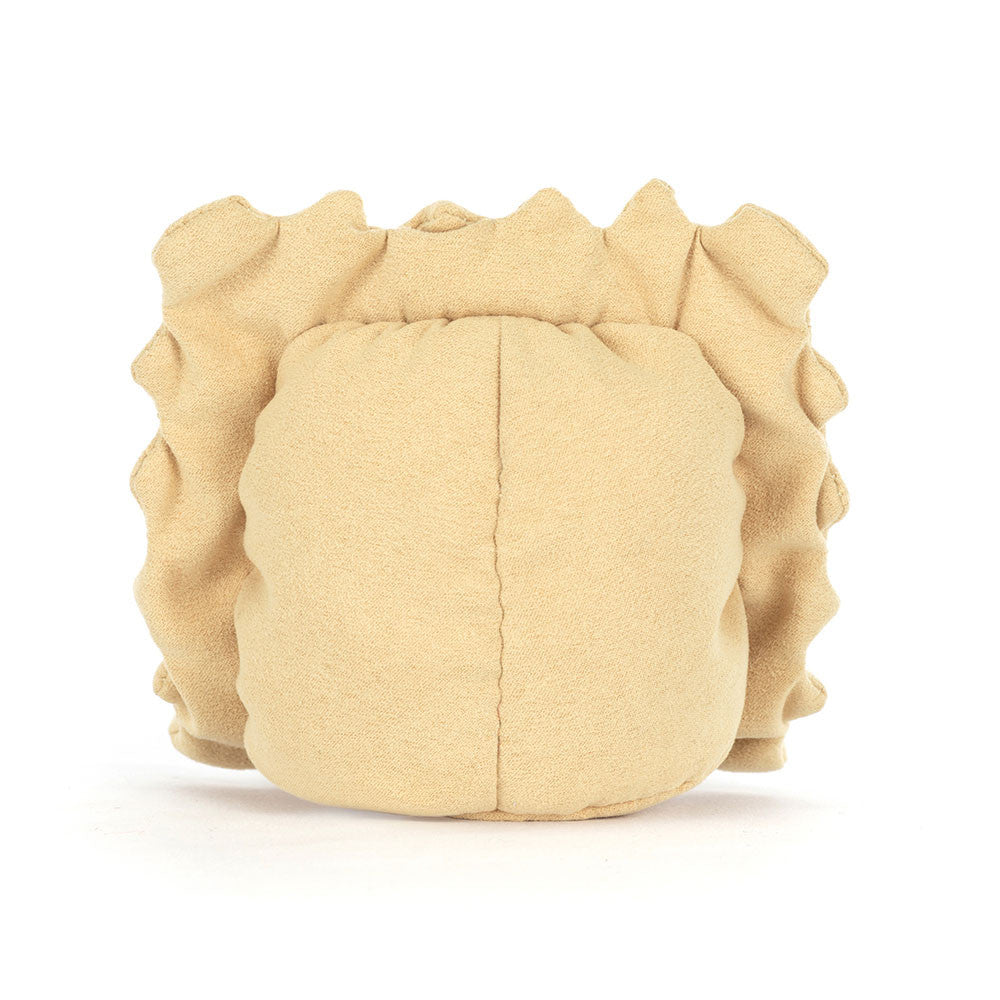 A photo of the back of a plush toy resembling a ravioli pasta with a smiling face, golden beige body, and brown legs on a white backround.