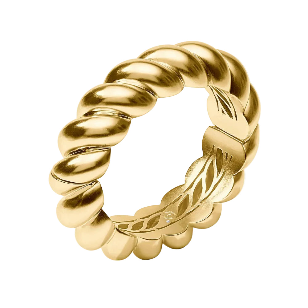 Gold ring with twisted design on a white background