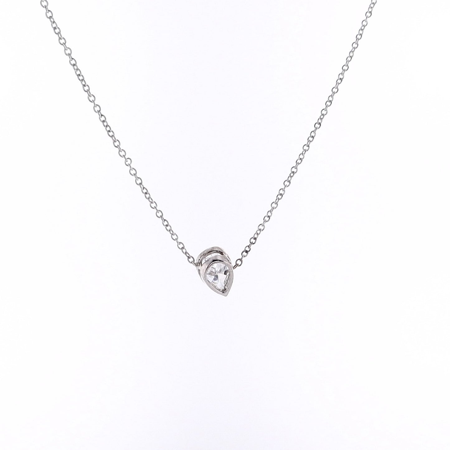 Pear shape diamond pendant necklace on a white background