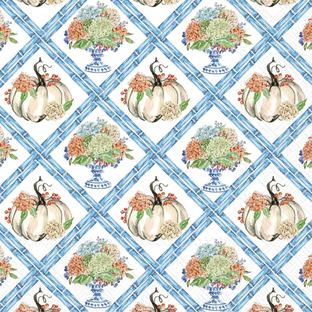 A repeating pattern featuring watercolor-style pumpkins with floral bouquets in blue-and-white vases, overlaid on a blue lattice grid background.