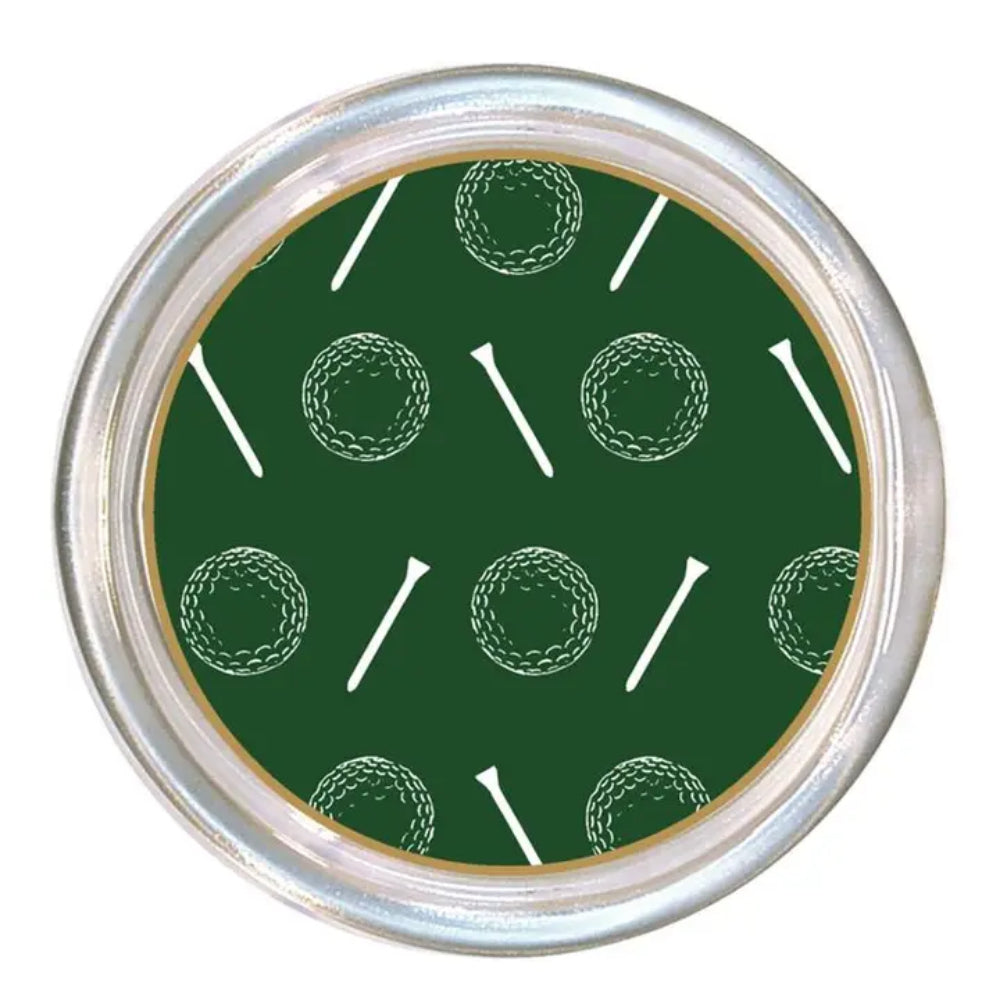 A round silver metal coaster with a dark green insert featuring a repeating pattern of white golf balls and tees.