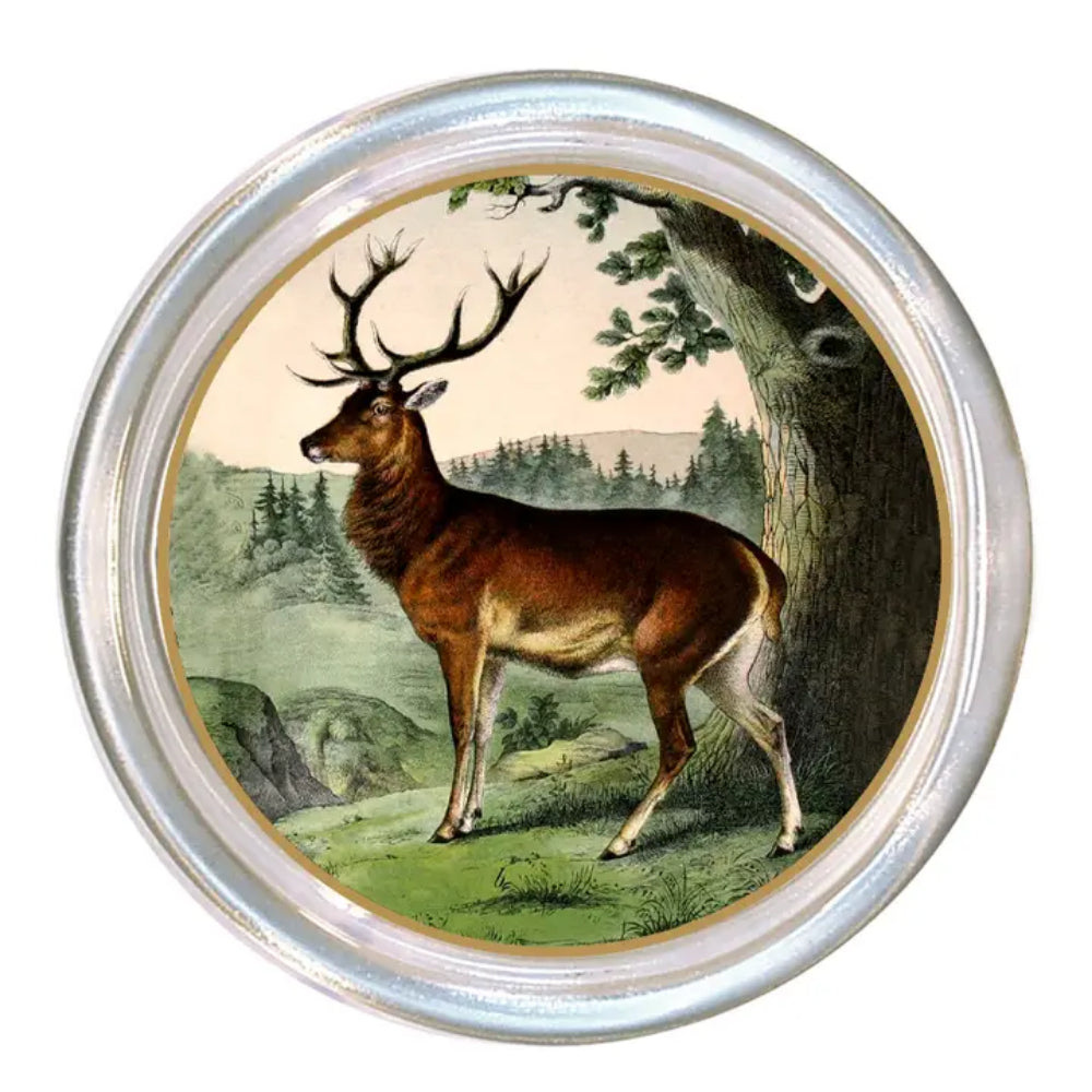Round silver-toned metal coaster featuring a vintage-style illustration of a brown deer standing beside a tree in a green landscape.