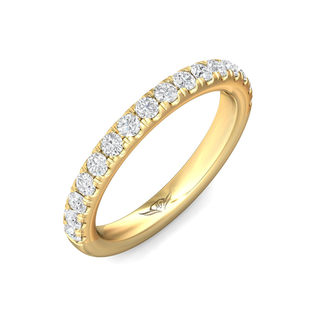 Gold ring with diamonds on a white background