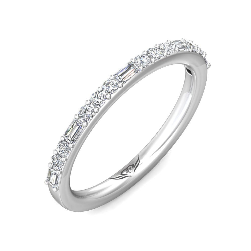 Silver ring with baguette-cut diamonds on a white background