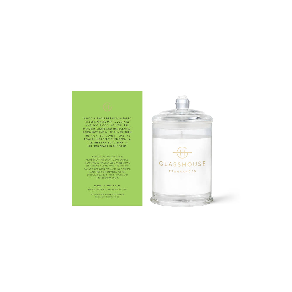 The back of a glasshouse candle packaging with text and clear "Picture Perfect Palm Springs" candle on a white background.