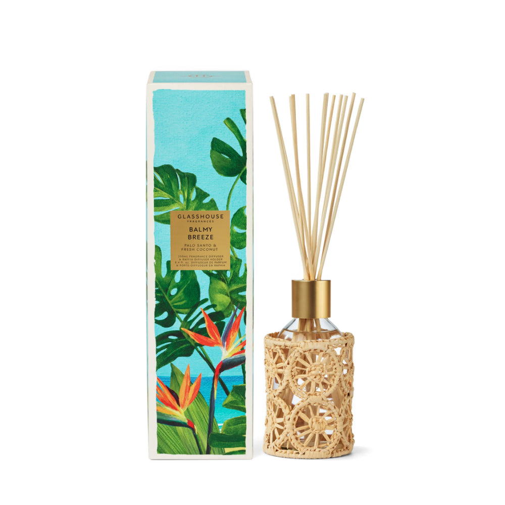 Diffuser with decorative packaging featuring tropical plants on a white background