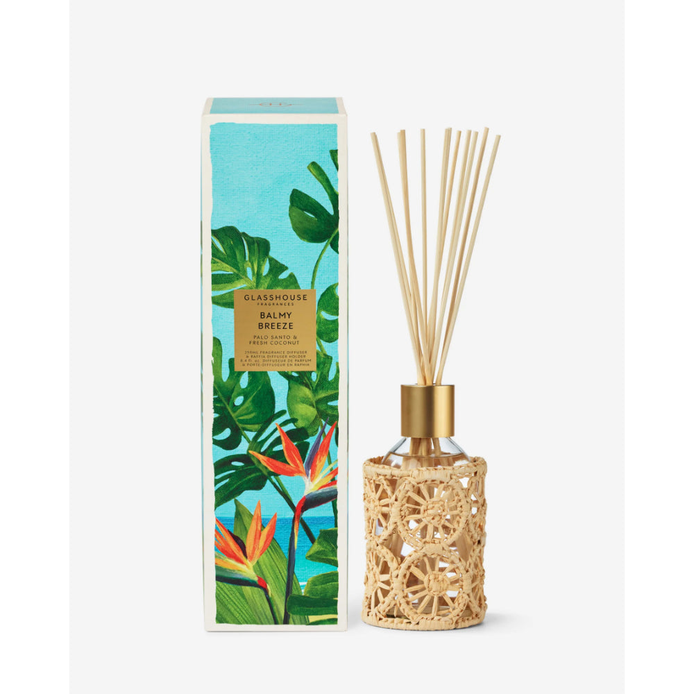 Diffuser with decorative packaging featuring tropical plants on a white background