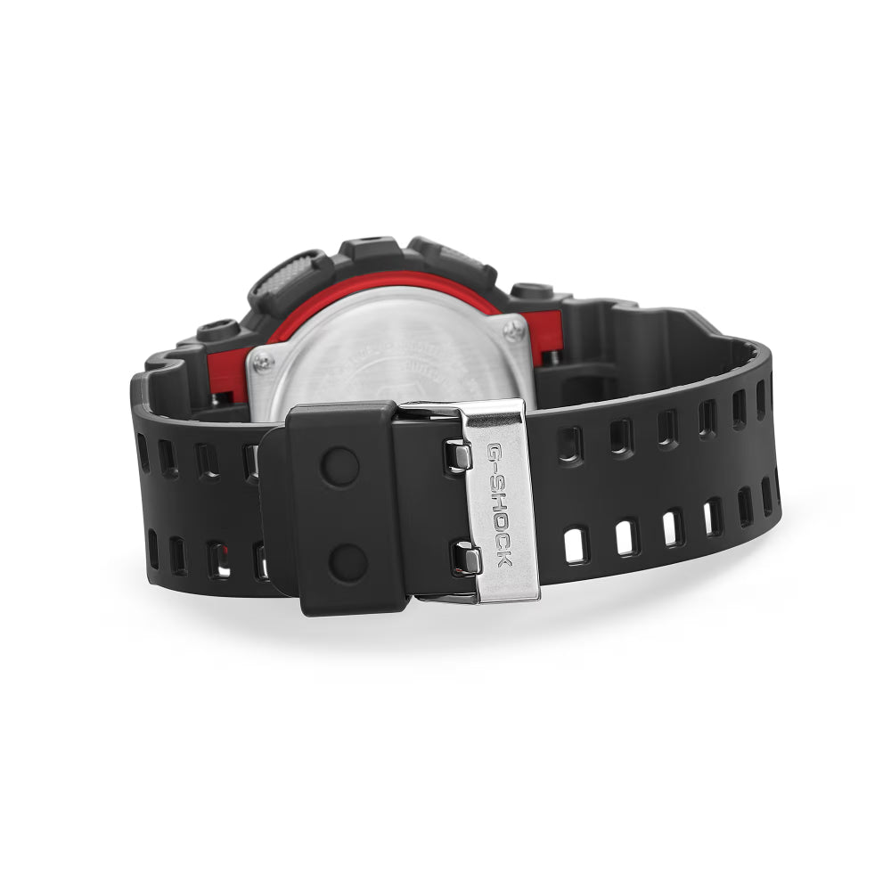 Black Casio watch with red accents on a white background