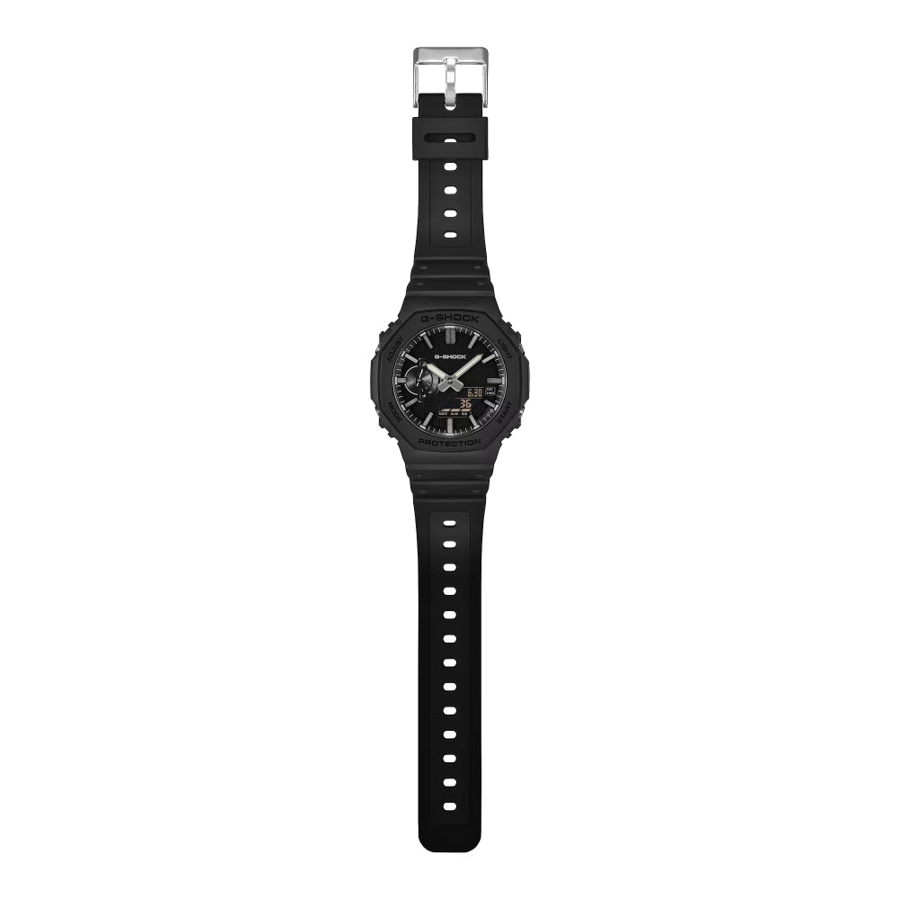 A black digital watch with a black strap and silver buckle, shown vertically against a plain white background.