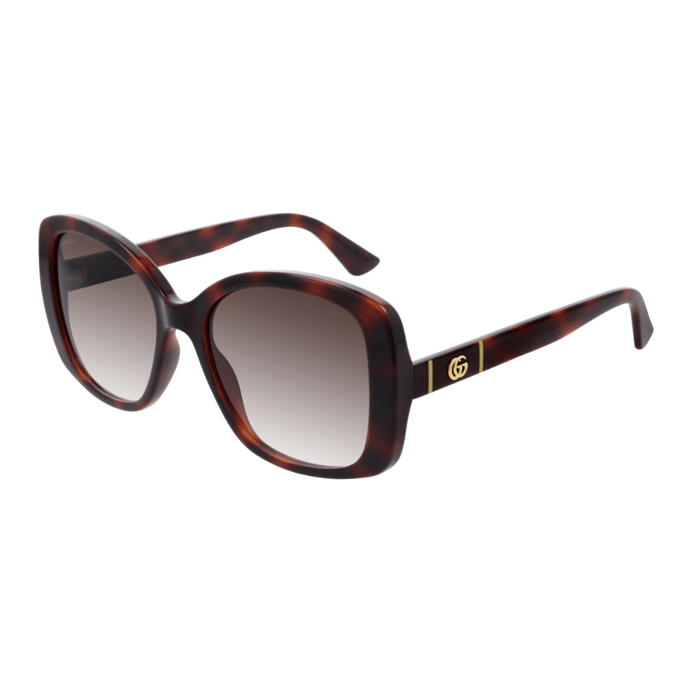 Sunglasses with tortoiseshell frame and gradient lenses on a white background
