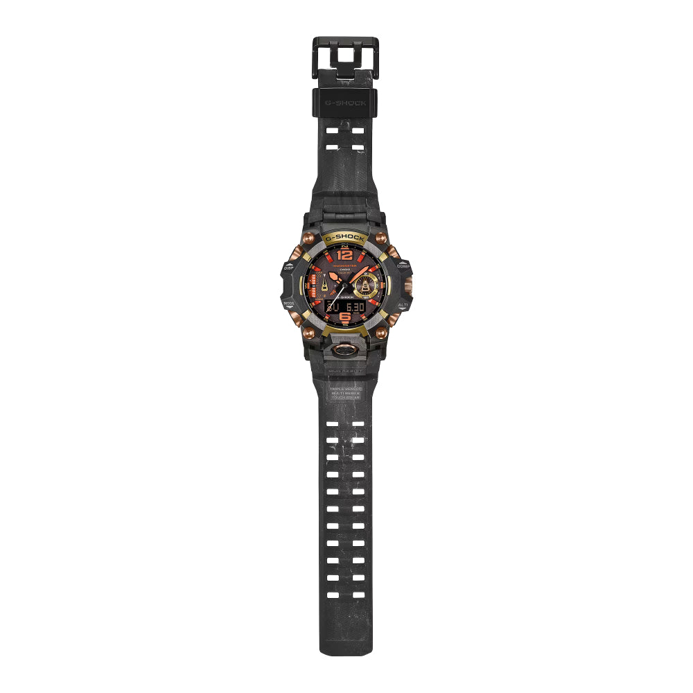 A rugged black sports watch with a textured black strap, a black bezel, and a dial featuring red, orange, and gold details, shown against a plain white background.