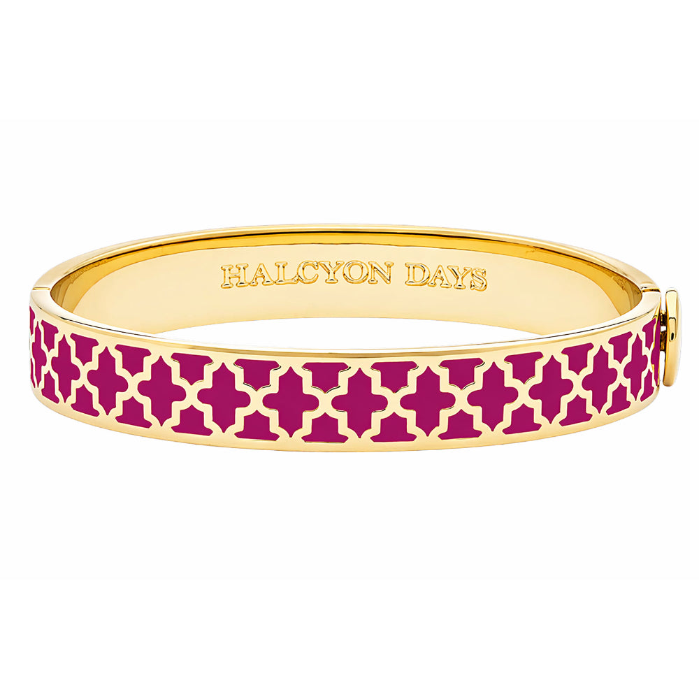 Gold bracelet with pink pattern on a white background