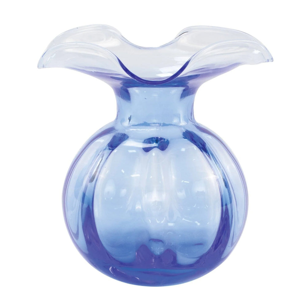 Cobalt blue glass vase with a wavy top on a white background