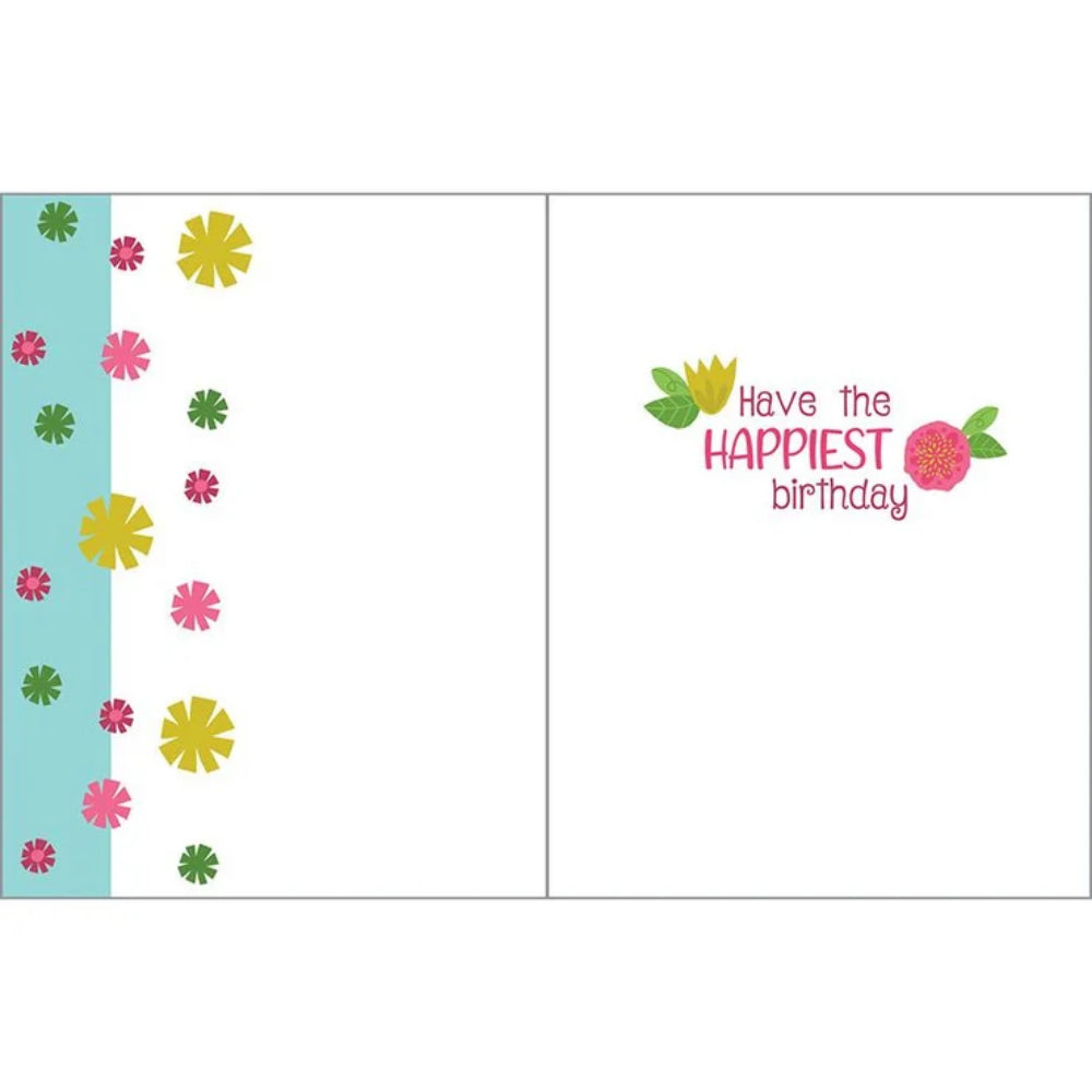 An open greeting card shown front and back. The left panel has a light blue vertical band with scattered pink, yellow, and green flower motifs.