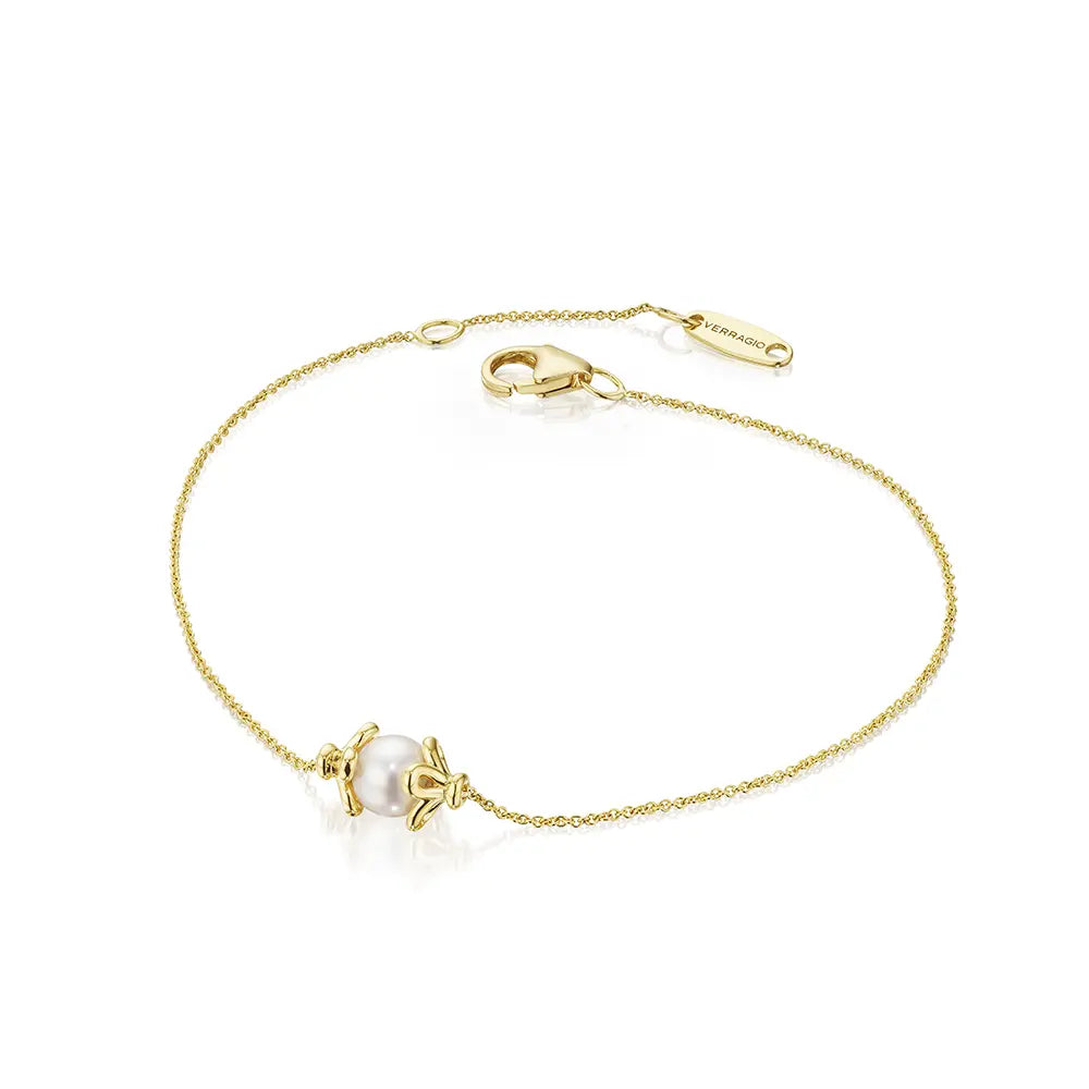 Gold bracelet with a pearl charm on a white background