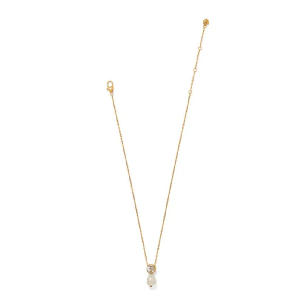 A delicate gold chain necklace featuring a small gold bead, a clear teardrop crystal, and a small white pearl pendant, displayed against a solid white background.