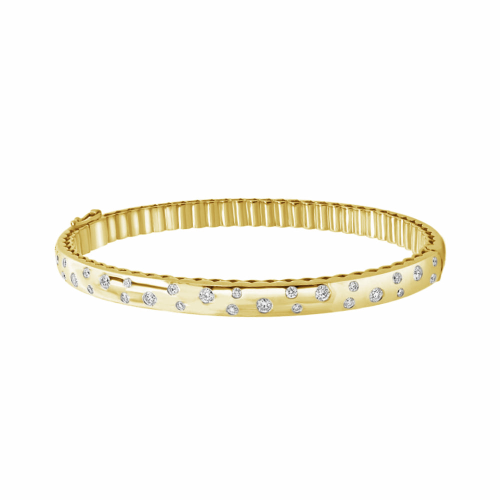 Yellow gold bracelet with scattered embedded diamonds on a white background