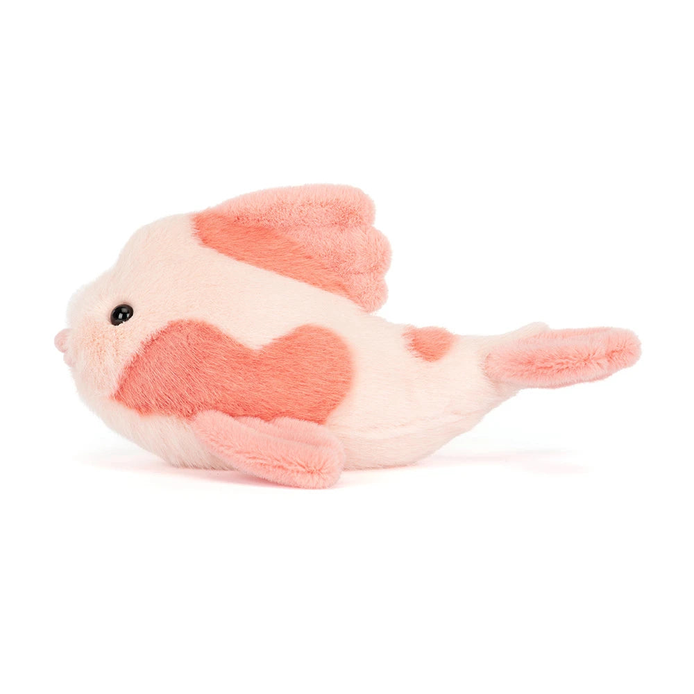 Side photo of a pink fancy carp fish plush toy in differant shades of pink on a white backround