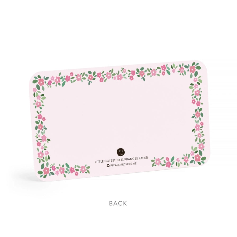 Back of a notecard with floral border design on a pink background with 'Back' text.