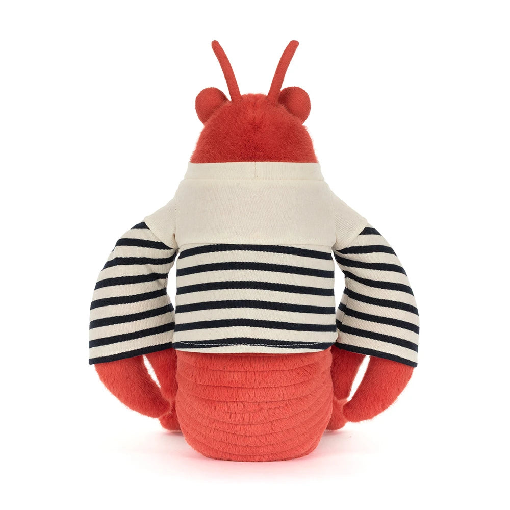 A photo of the back of stuffed animal red lobster in a sailor outfit with a white & blue striped shirt that says "Jellycat" in the upper left hand corner in blue on a white backround