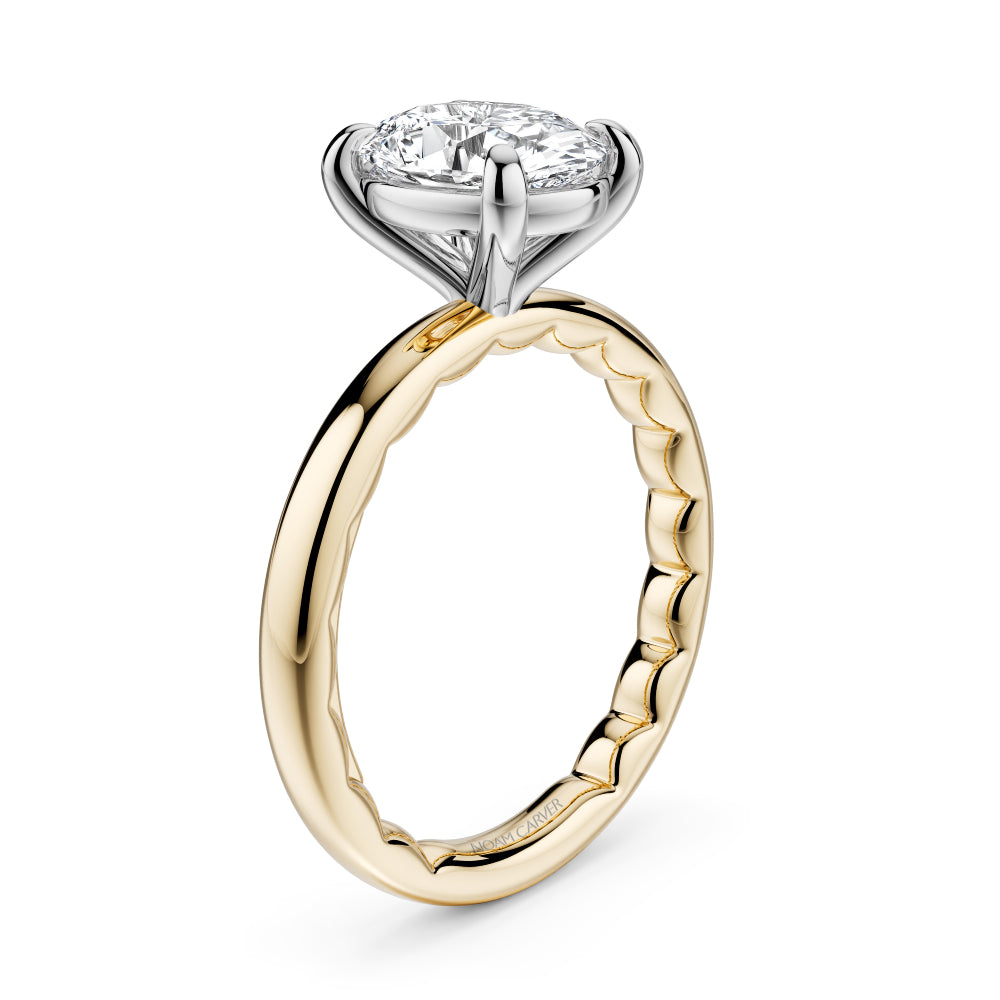 Two-tone gold Noam Carver ring with a large oval diamond on a white background