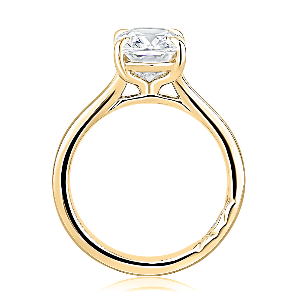 Gold ring with a diamond on a white background