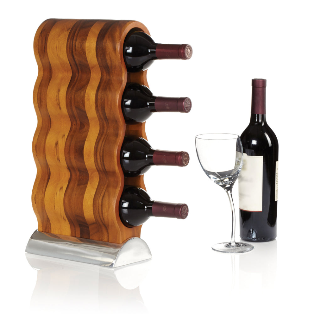 Vertical standing wooden wine rack with a sliver base and wavy design with wine bottles in it and a wine glass and bottle on a white background