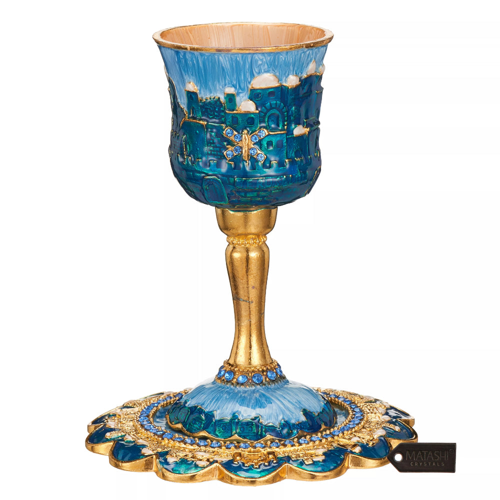 Decorative blue and gold goblet with intricate designs on a white background