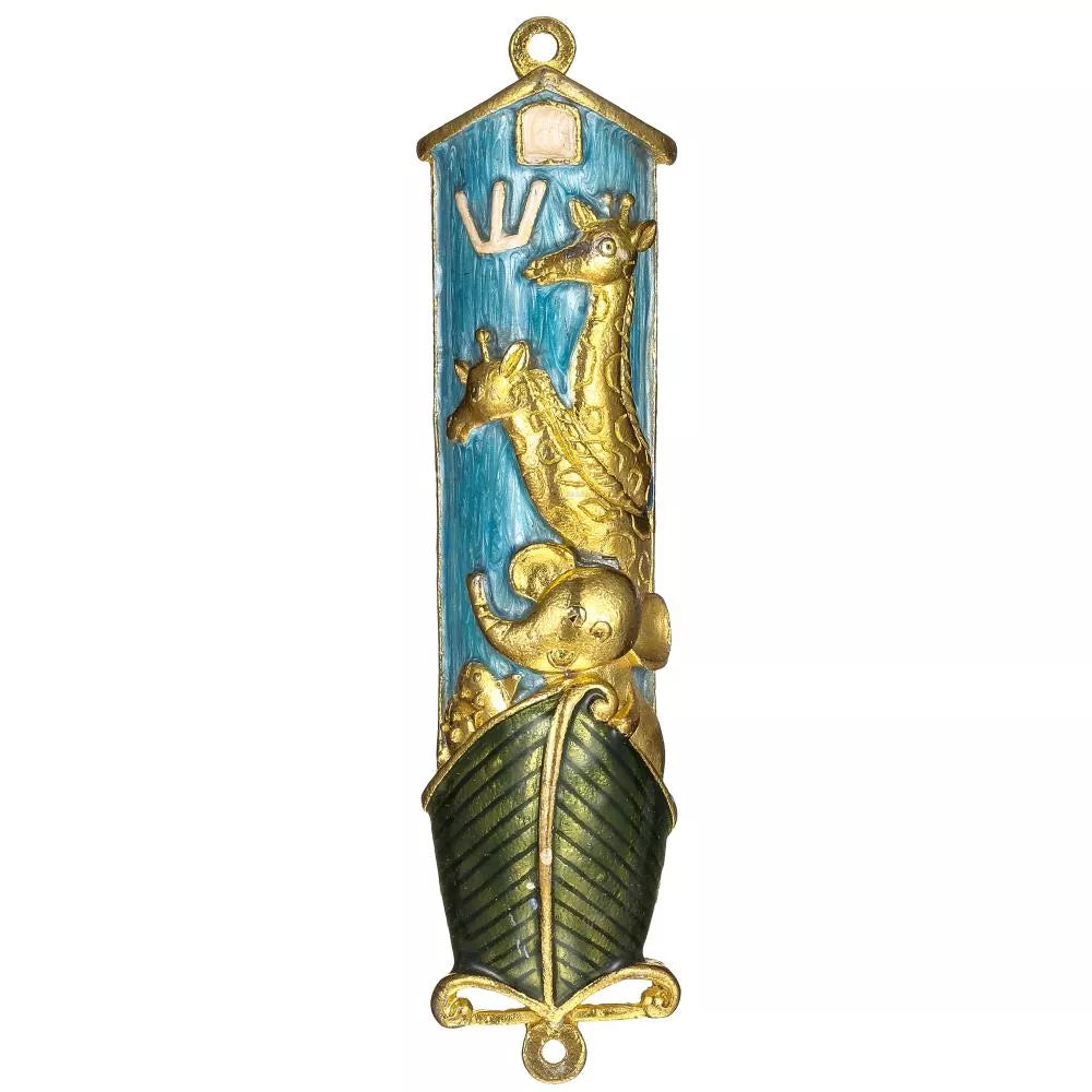 Decorative mezzuzah with gold and green design on a white background